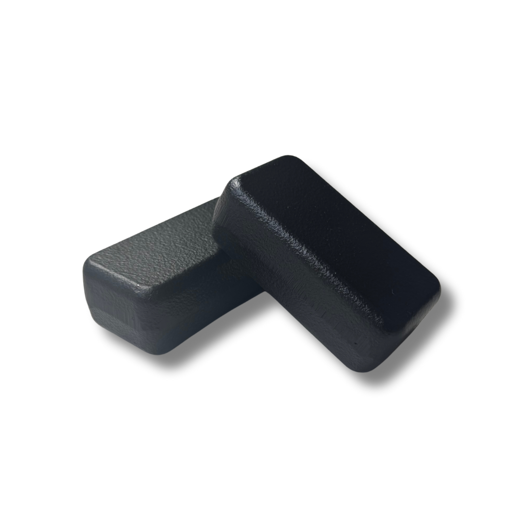 Two black iron blocks on a white background