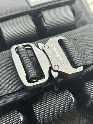 Close-up of a black weight vest with a Coast Cali brand buckle.