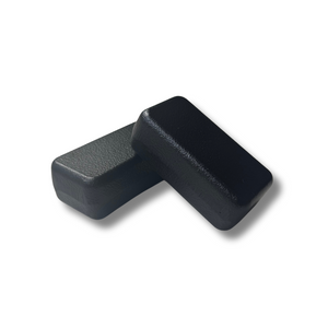 Two black iron blocks on a white background
