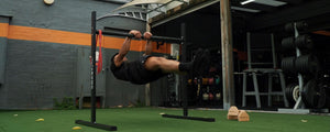 Man doing a front lever on static bar